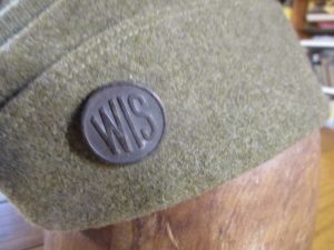 pre-WWI National Guard collar disc on a military hat