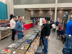 Military Collectors- Fred Green and Dale Bledsoe Running a Military Trade Show Table